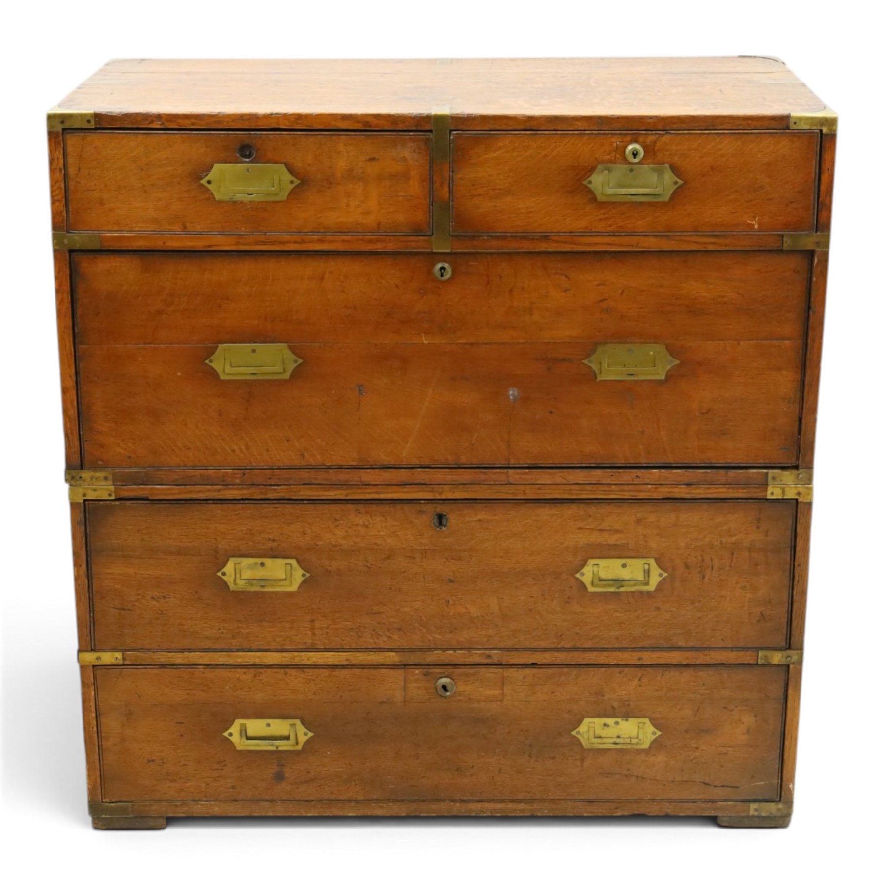 19th century brass bound mahogany campaign chest, with brass bound corners and edges, recessed brass handles, the upper section with two short over one long drawer, the lower section with two long drawers