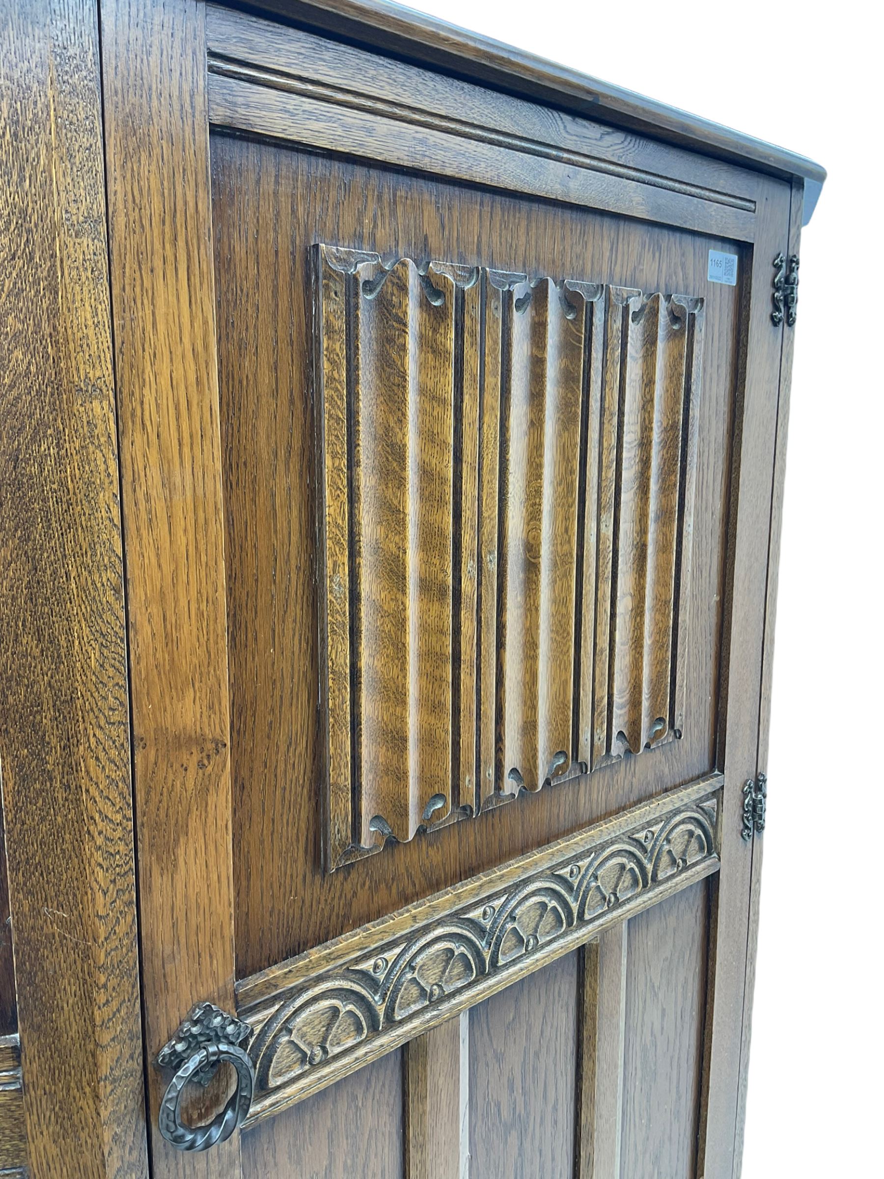 Early to mid 20th century oak hall wardrobe, single door with linenfold panel