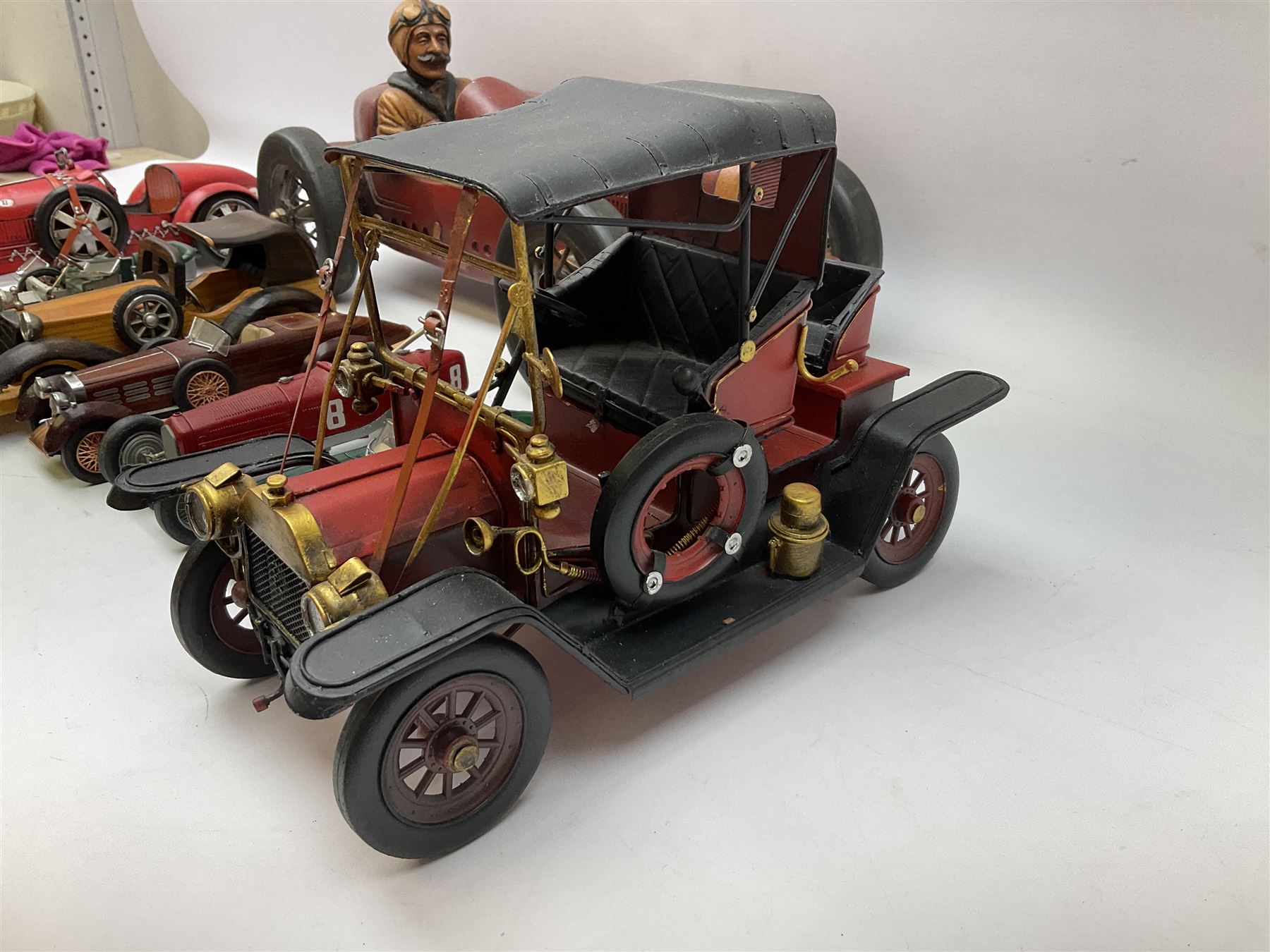 Four Franklin Mint Precision Models, one with hardwood body; large reproduction model of a vintage racing car L52cm; and four other modern metal/wooden models of vintage cars; all unboxed (9)