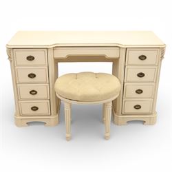 Contemporary French design white painted bedroom suite retailed by Barkers of Northallerton, comprising wide chest fitted with four short and four long drawers with oval brass handles (H 70cm, W 159cm, D 46cm), pair of bedside chests each fitted with three drawers (H 62cm, W 40cm, D 46cm), dressing table fitted with four short drawers and central kneehole with shaped apron (H 79cm, W 131cm, D 46cm) with matching framed wall mounted mirror (H 100cm, W 113cm), and full length standing mirror (H 175cm, W 73cm)