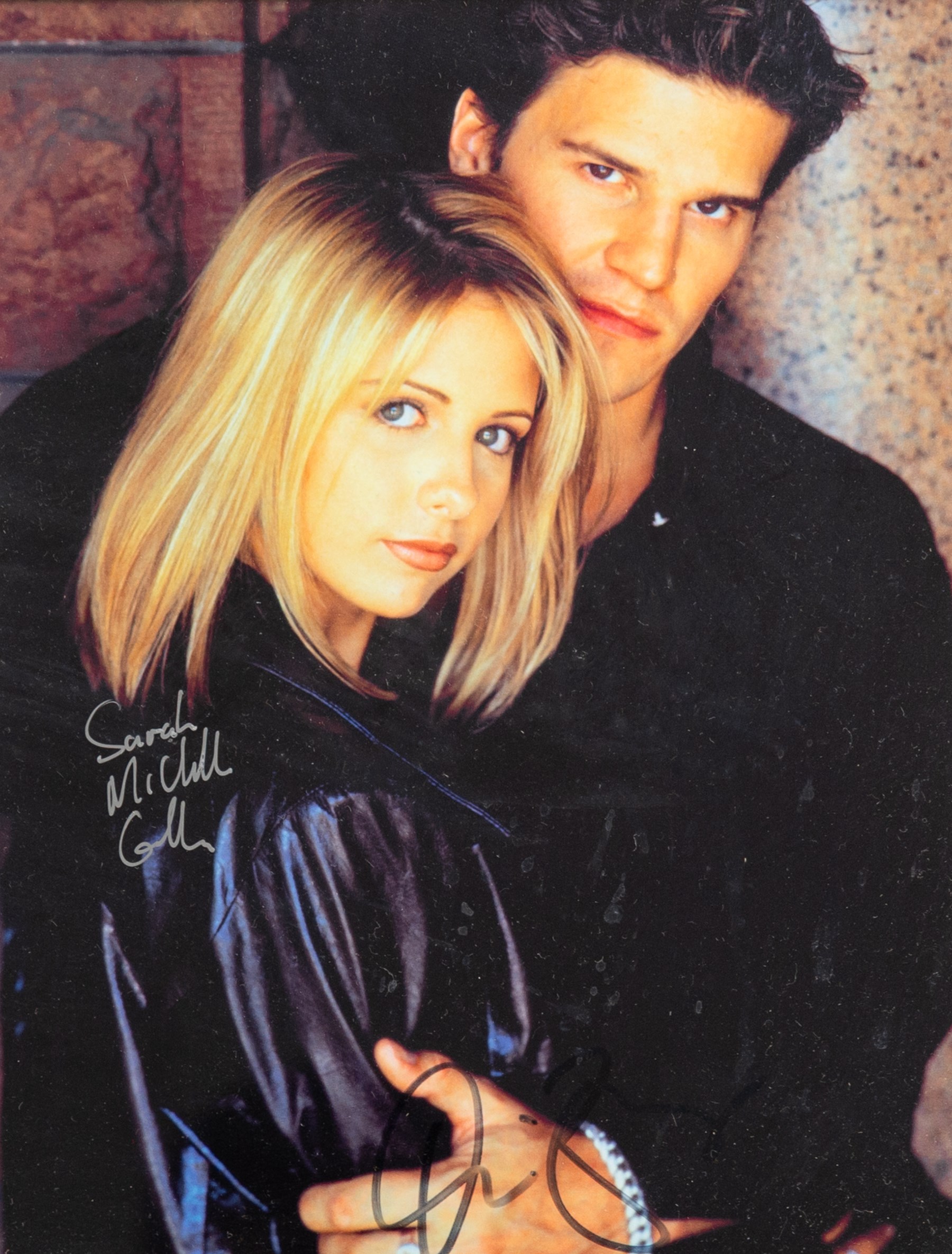 Signed Buffy the Vampire Slayer montage, comprising limited edition print signed by artist Julie Bell to the centre bordered by signed cast photographs to include Sarah Michelle Gellar, Anthony Head, Alyson Hannigan, David Boreanaz, James Marsters and Juliet Landau, in large presentation frame, frame H109cm, W126cm