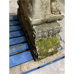 Life-size weathered cast stone Greek Discus Athlete, seated on rectangular slab raised on associated architectural plinth