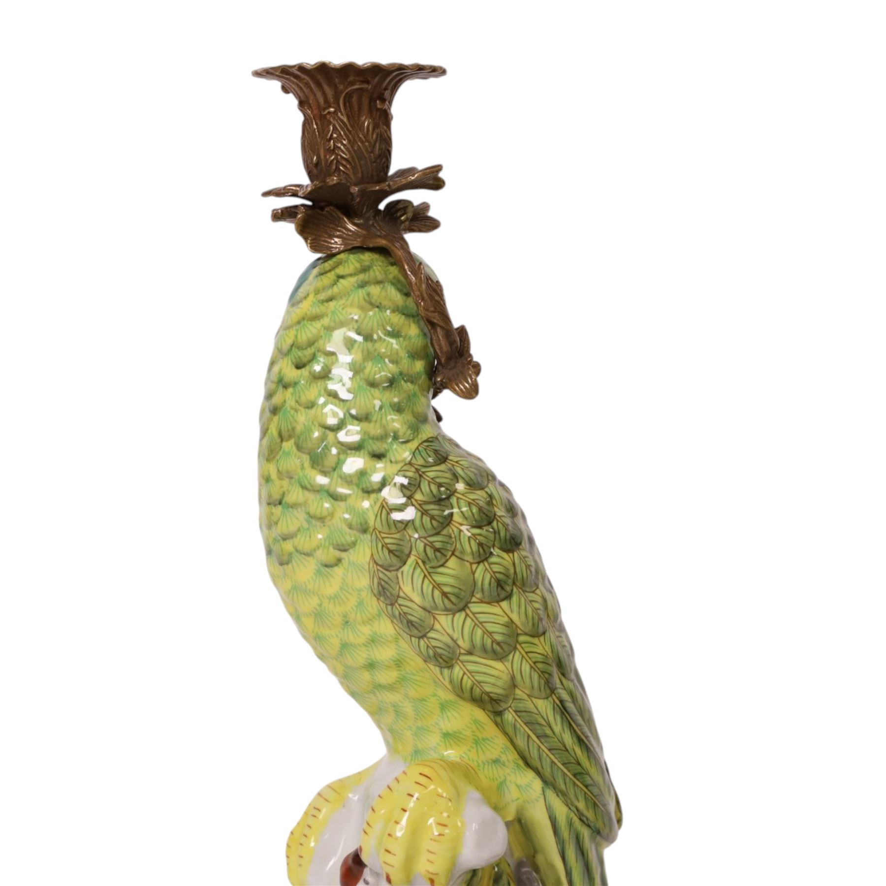 Pair of candlesticks, modelled as green parrot upon a flowering branch, upon four gilt acanthus leaf feet, H36cm