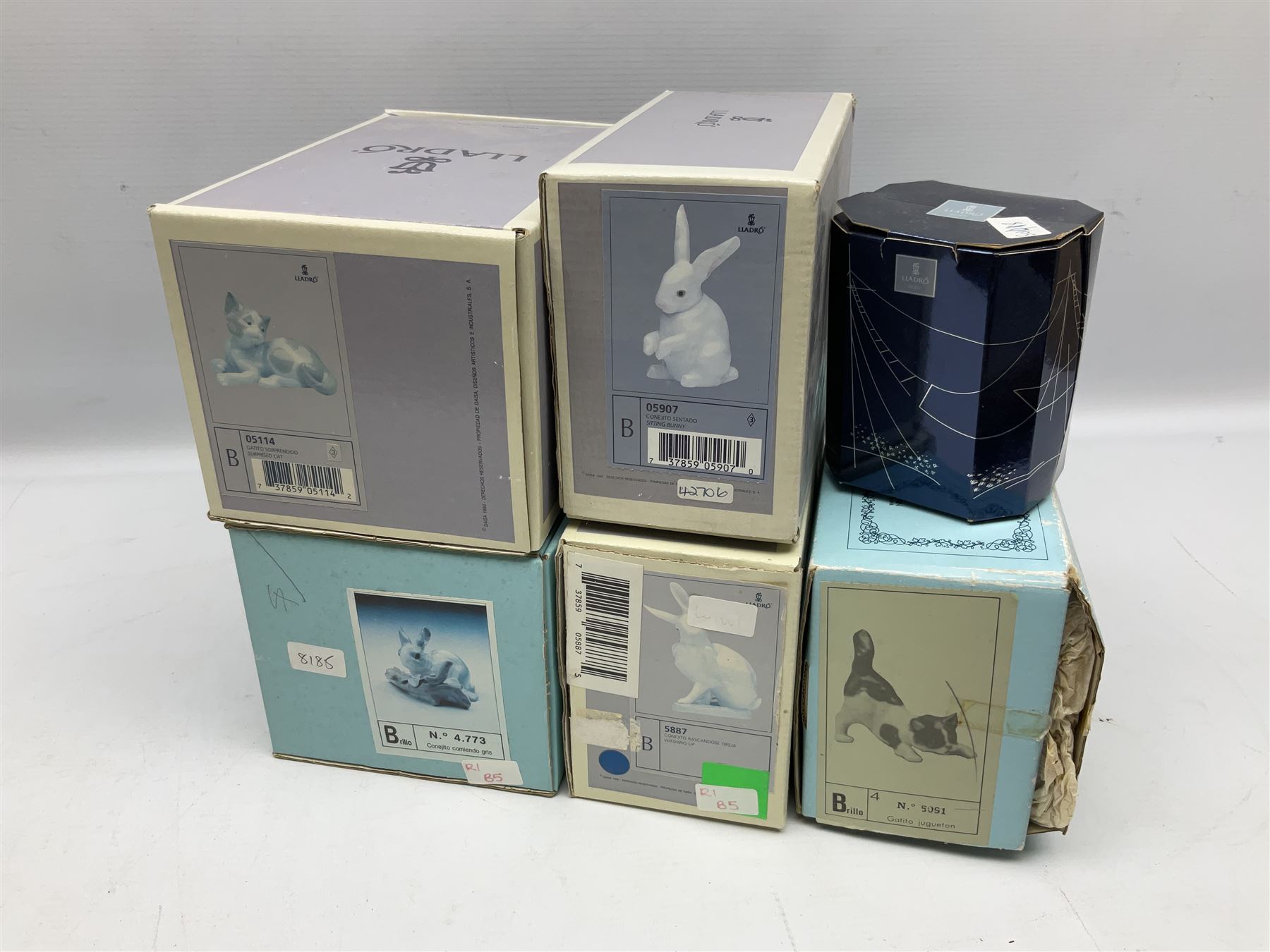 Six Lladro figures, comprising A Friend for Life no 7685, Rabbit Eating no 4773, Sitting Bunny no 5907, Washing up no 5887, Surprised cat no 5114 and Scar-dy Cat no 5092, all with original boxes, largest example H15cm 