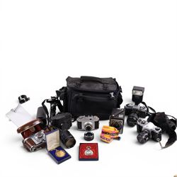 Collection of cameras, including Minolta X300 with a Vivitar 28-80mm lens, Asahi Pentax SP...