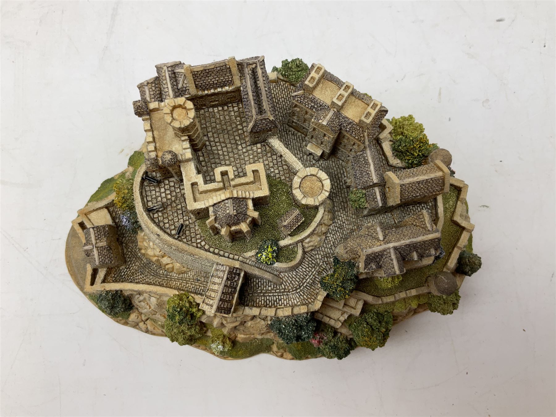 Four Lilliput Lane models from the 'Britain's Heritage' collection, comprising Edinburgh Castle, The World Famous Blacksmith's Shop Gretna Green, Shakespeare's Birthplace and Mickelgate Bar York, together with  a Lilliput Lane Beatrix Potter Hill Top model, all boxed