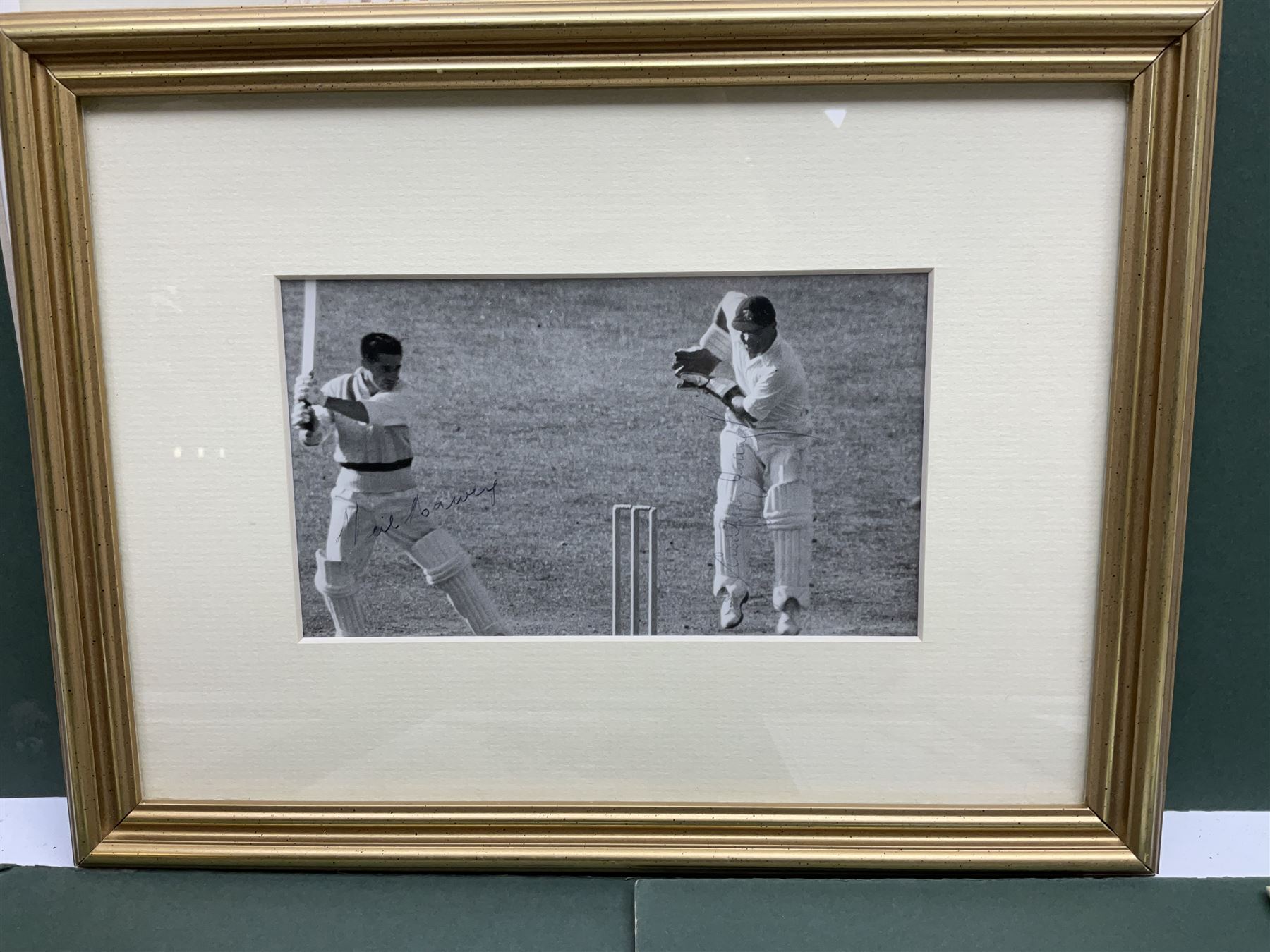 Cricket interest; signed original photograph of 1956 England V Australia Test match, cricket cap from England/Australia Test Match 2006 in Melbourne, eight coloured cricketing spy prints in mounts 