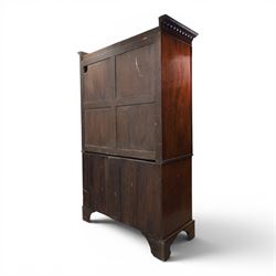 George III mahogany linen press, projecting dentil cornice, moulded doors enclosing a shelved interior, above a lower section with two short over three long drawers, raised on bracket feet 