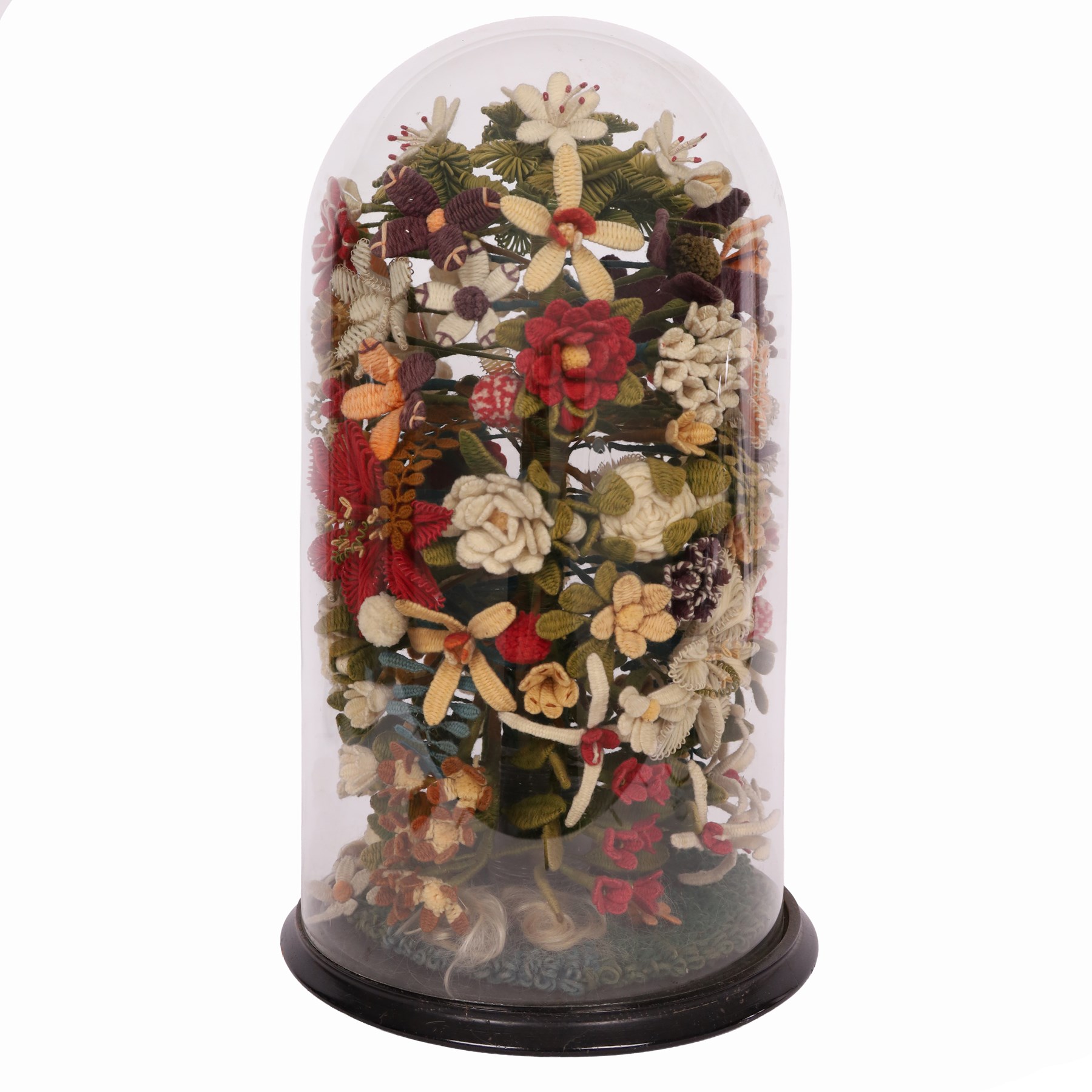 Victorian glass specimen dome, with woolwork floral centre piece upon a circular ebonised base, H62cm 