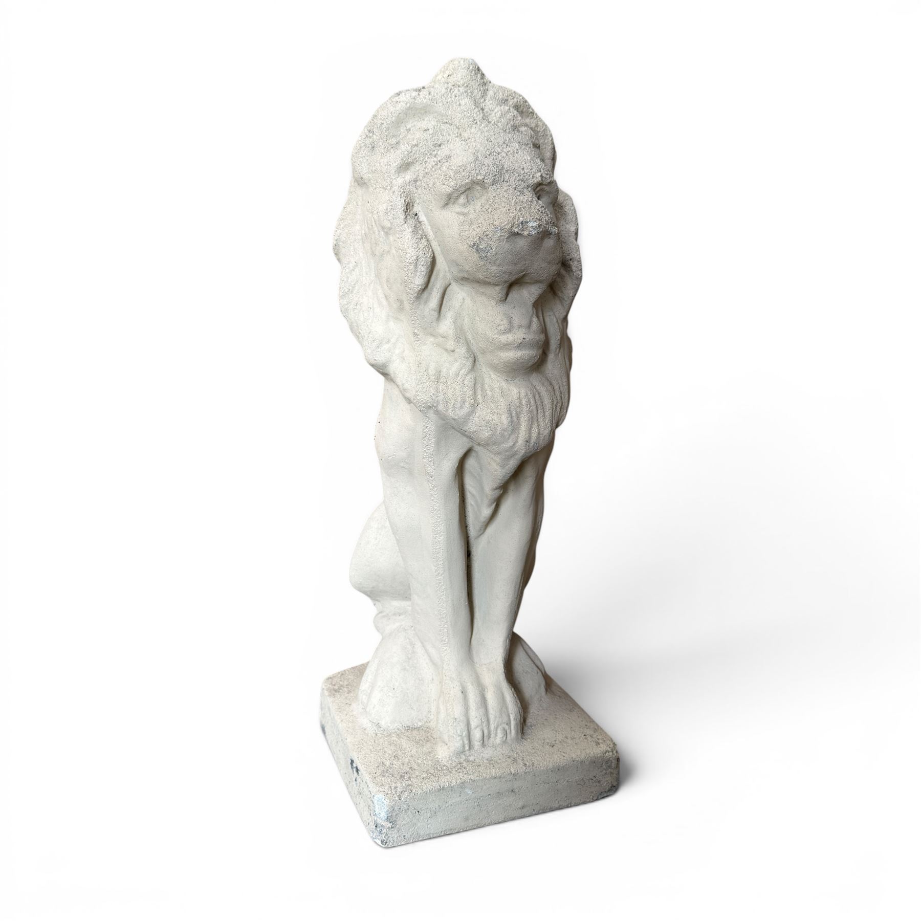 Pair of cast stone seat lions, male and female figure, and a miniature pair of cast stone lions