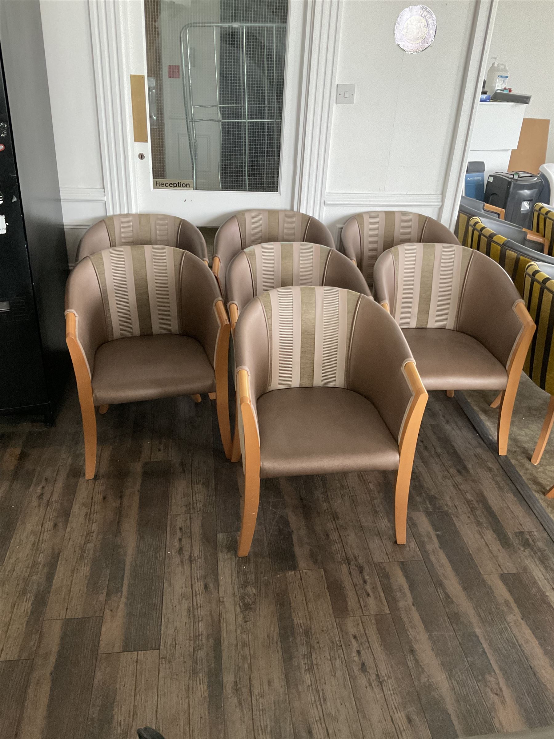 Seven tub shaped armchairs, beech framed, bronze and pattern cover- LOT SUBJECT TO VAT ON THE HAMMER PRICE - To be collected by appointment from The Ambassador Hotel, 36-38 Esplanade, Scarborough YO11 2AY. ALL GOODS MUST BE REMOVED BY WEDNESDAY 15TH JUNE.