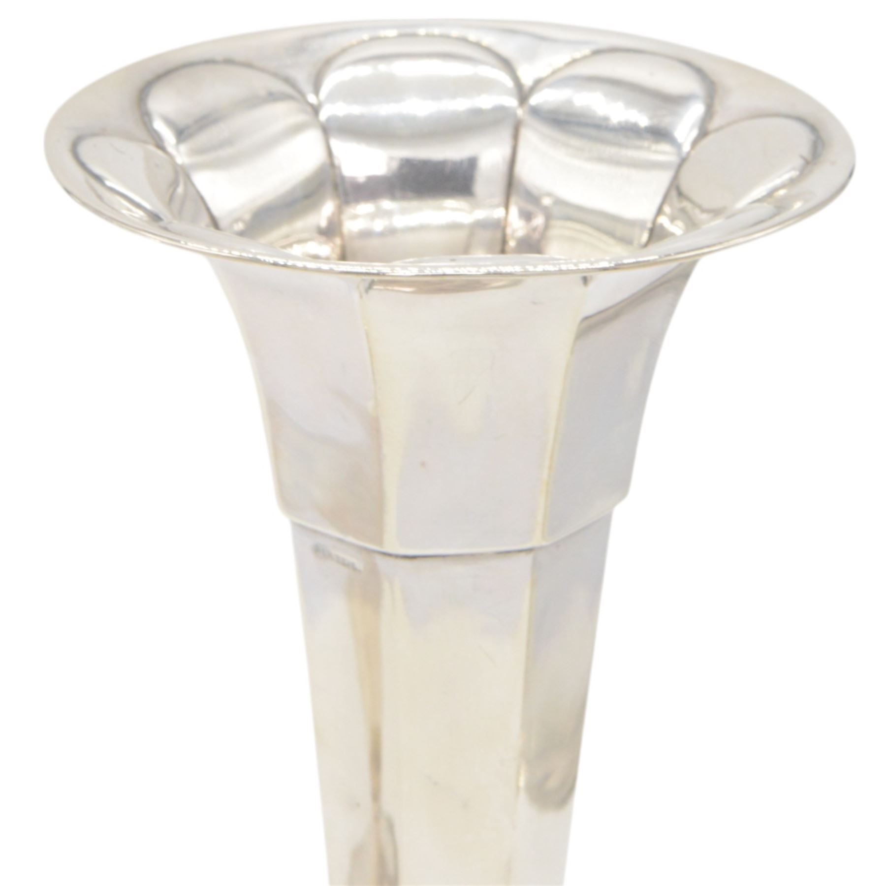 Two 1920s silver mounted trumpet vases, the first example of faceted form, hallmarked James Deakin & Sons, Sheffield 1921, the second example with fluted rim, hallmarked Walker & Hall, Birmingham 1922, tallest H25cm