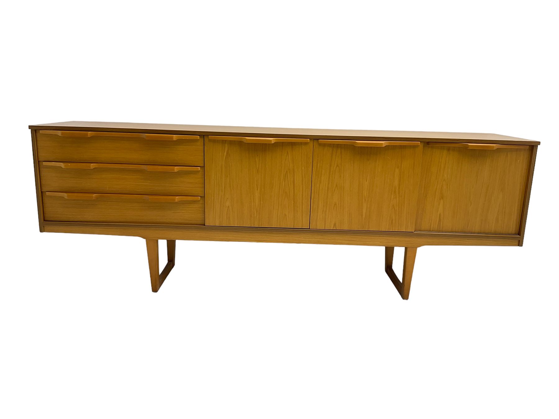 Stonehill Furniture (SF) Ltd - mid-20th century teak sideboard, rectangular topover three drawers, two cupboard doors and fall-front drinks cupboard, raised on square tapering supports