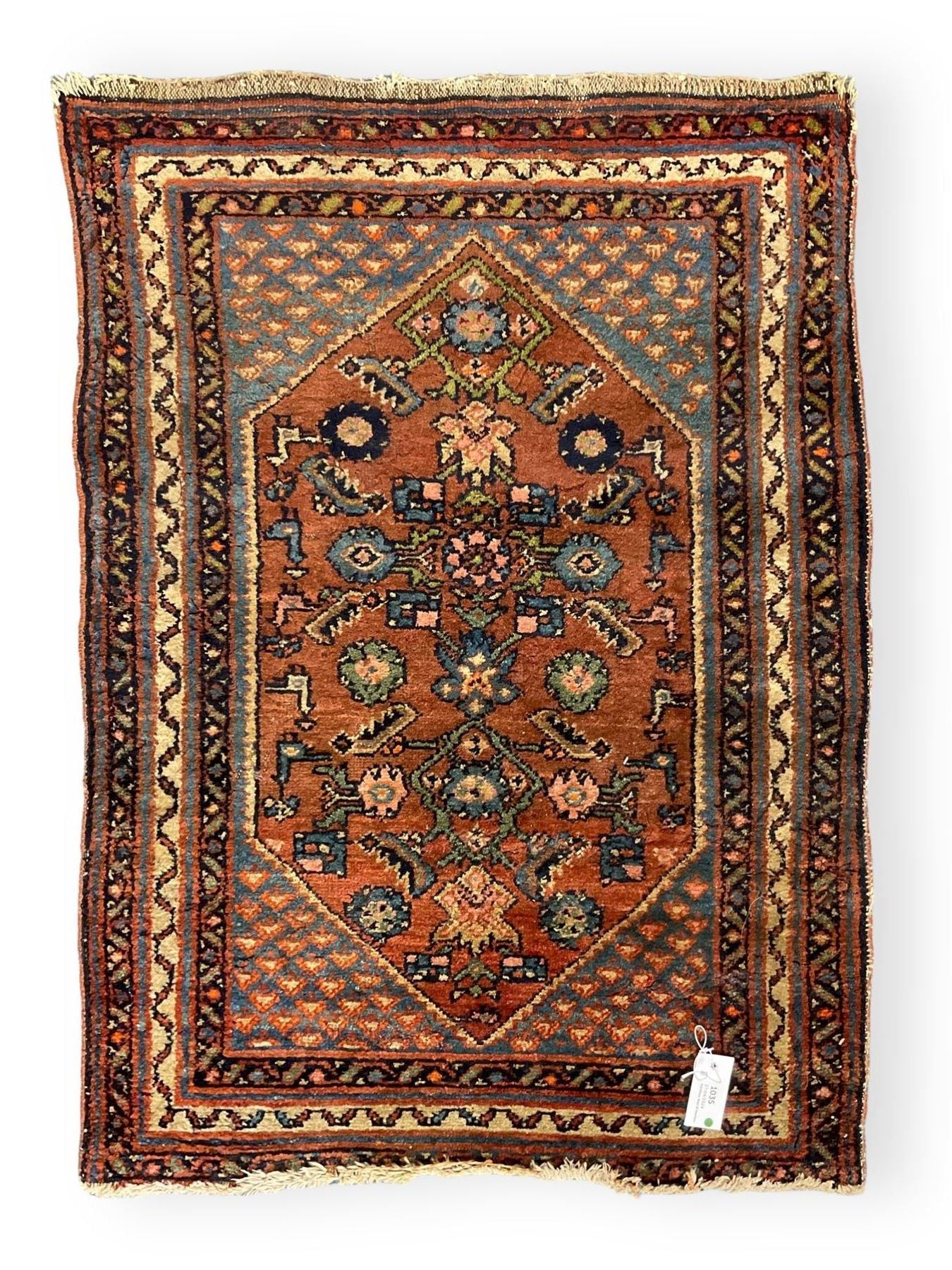 Small Persian rug or mat, decorated with Herati motifs within pattern borders 