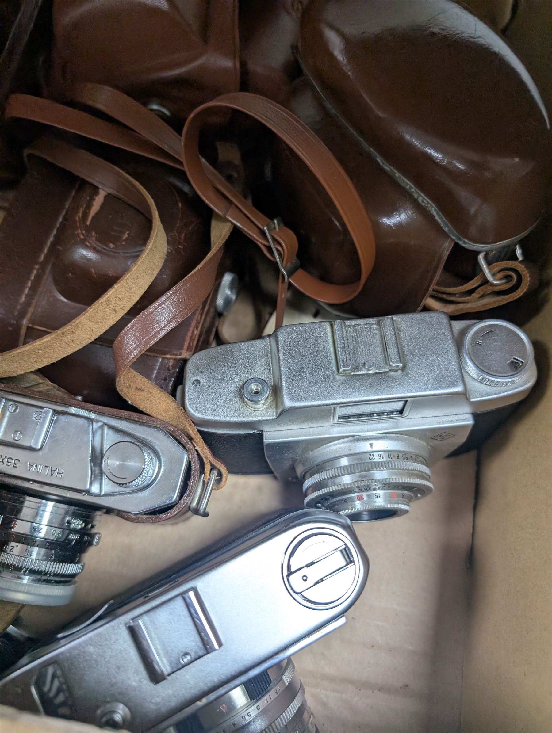 Eleven film cameras, comprising Afga, Halina and Ilford examples, including Halina 35X, Halina Paulette Electric, Ilford Sportsman, etc