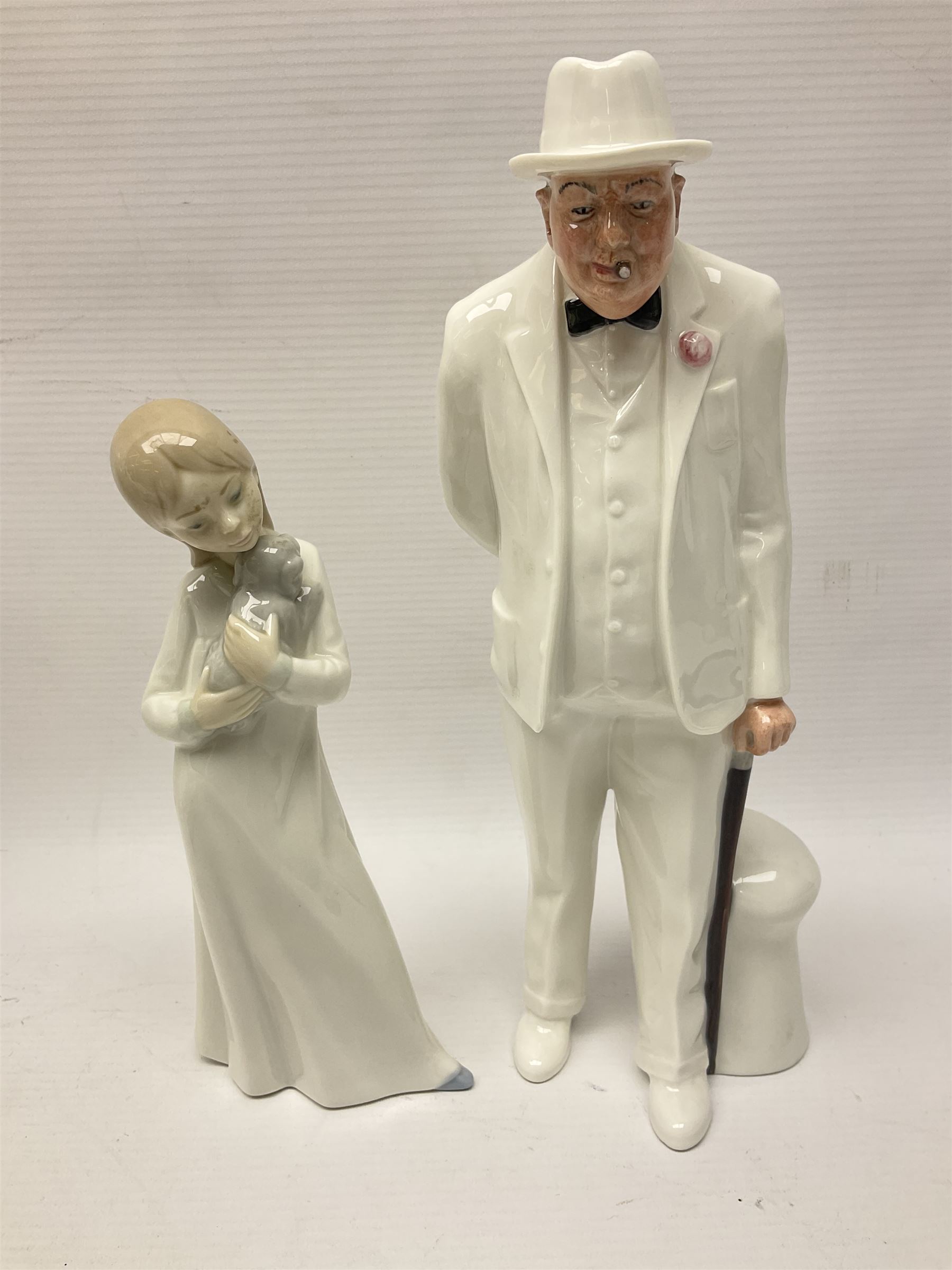 Six Royal Doulton figures, including Sir Winston Churchill HN3057, Peace HN2470, Lovers HN2762 etc, together with Lladro rabbit, and three Nao figures 