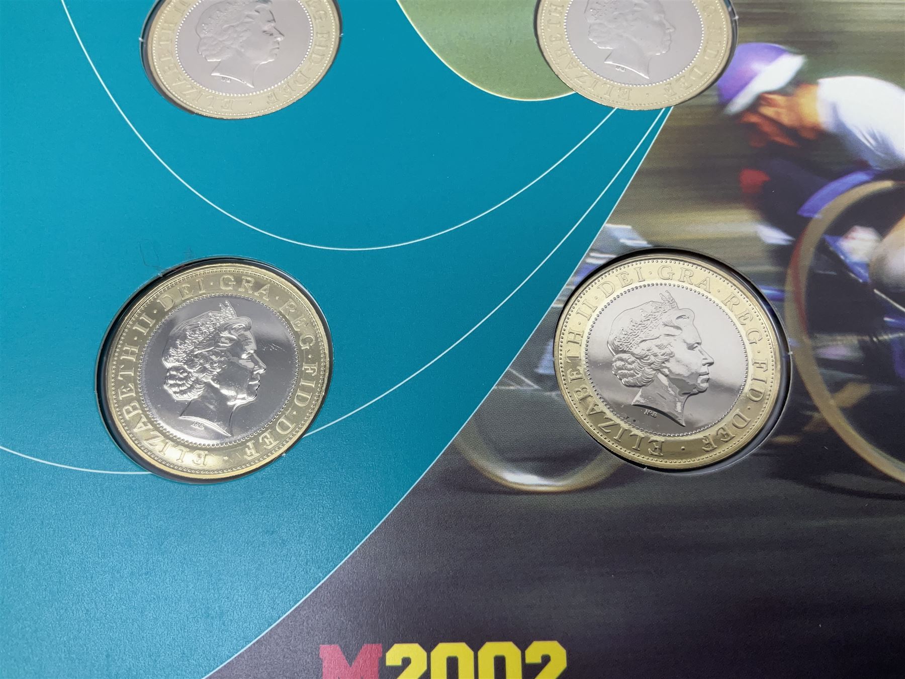 The Royal Mint Queen Elizabeth II 2002 Manchester Commonwealth Games four coin two pound coin  set in card display