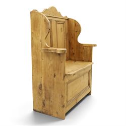 Victorian waxed pine settle or hall bench, shaped cresting rail over double panelled back, outswept arms on hinged box-seat, on end supports