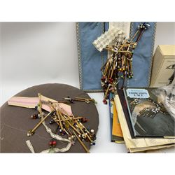 A quantity of lace making equipment, to include pillows, wooden bobbins, boxed bobbin winder, books, etc. 