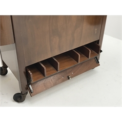  Mid 20th century mahogany drink trolley,  double hinged top reveals fitted interior including glass holders and cocktail sticks, W116cm, H76cm, D41cm   