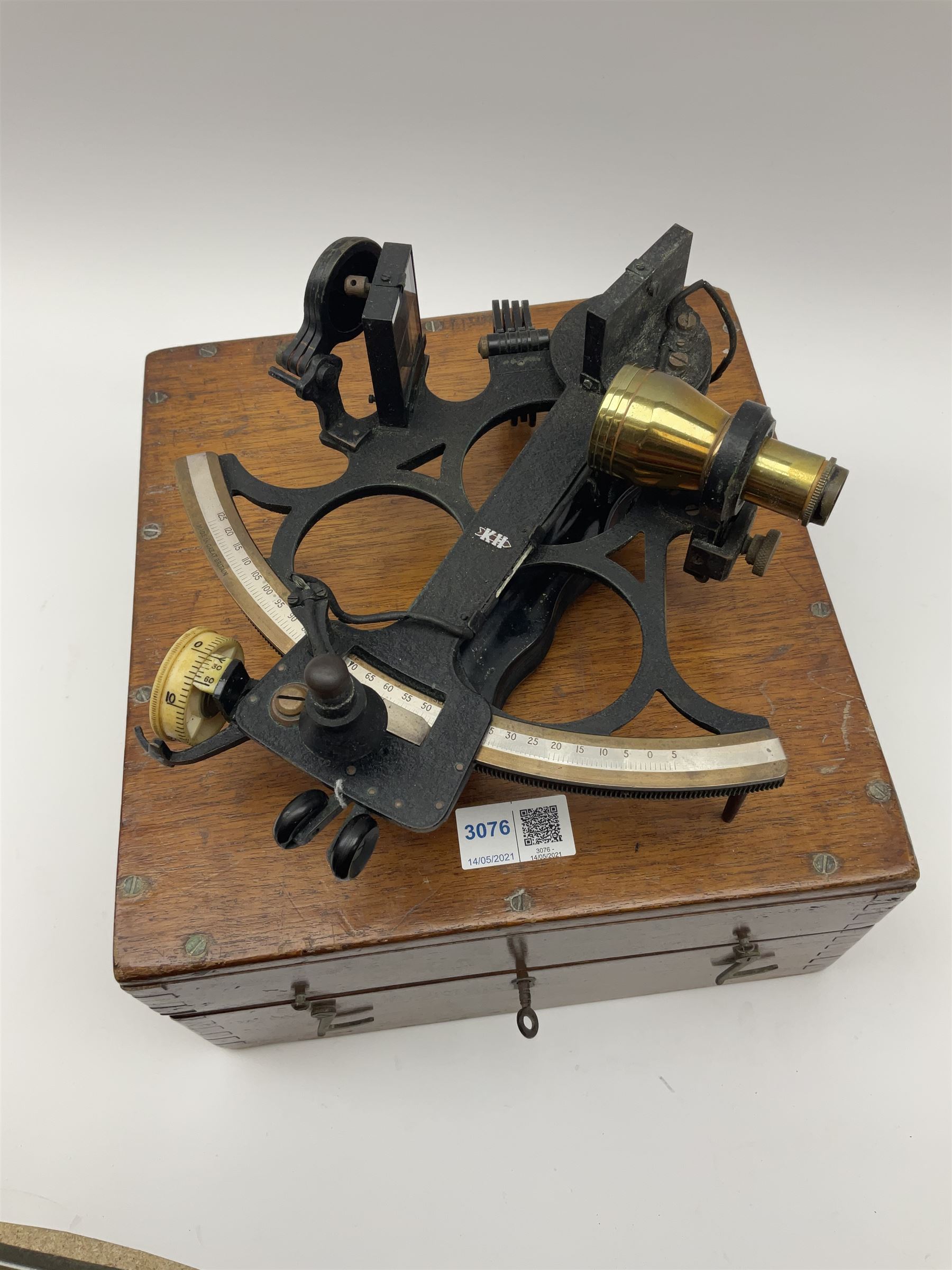 Henry Hughes & Son Ltd. sextant with black crackled finish, brass and silvered graduated arc and various coloured glass filters, serial no.60818, in fitted mahogany carrying box bearing Lilley & Reynolds Ltd. certificate dated 1962 W26cm