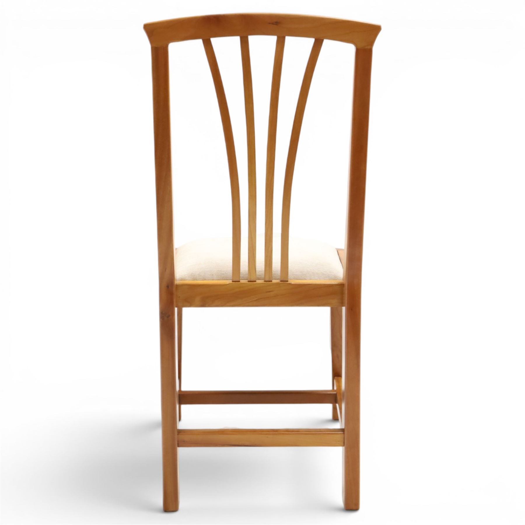 Knightman - set of nine cherrywood dining chairs, with fan splat backs and upholstered seats, raised on square legs joined by stretchers, comprising chairs of slight differing widths and one chair with turned front legs and orange upholstery and no Knight carving, the rest with recessed carved knight trademark, by Horace Knight of Old Mill Furniture, Balk near Thirsk 