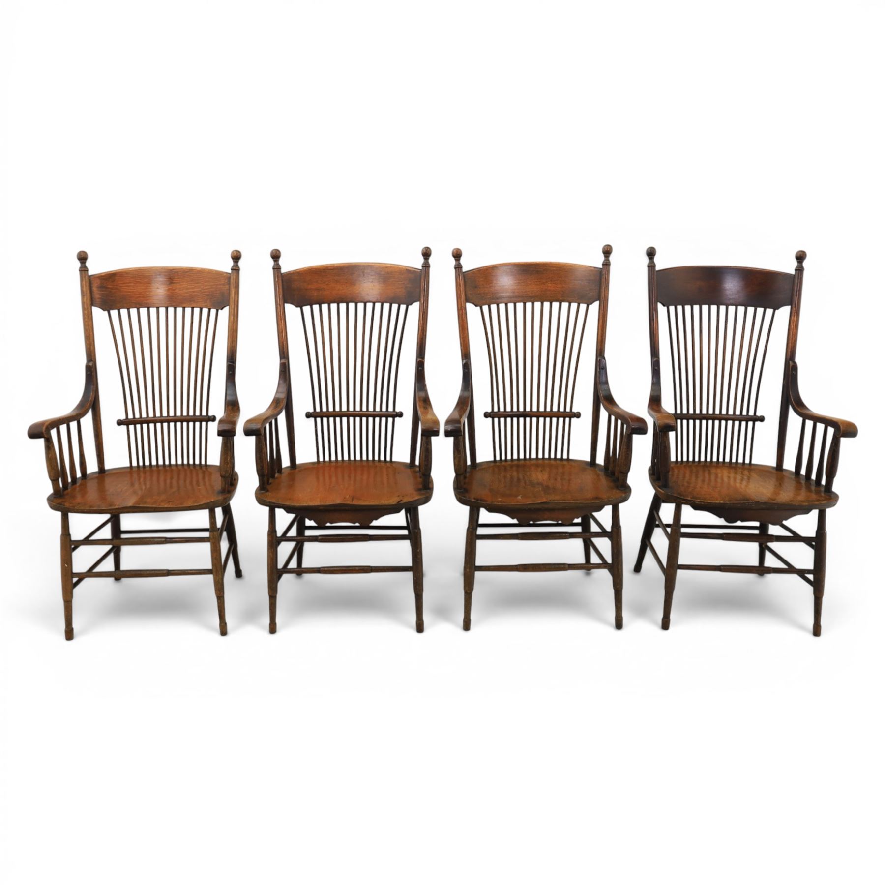 Set of eight 19th century ash and elm spindle back Windsor armchairs, arched top rails above fan-shaped spindle backs, curved arms with turned supports, shaped saddle seats, on turned legs joined by H-stretchers