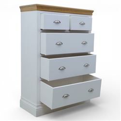 Modern chest of two short and three long drawers in white finish with oak moulded top, with metal cup handles, raised on a moulded plinth base
