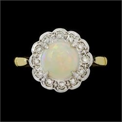 18ct gold opal and diamond flower head cluster ring, single oval cut opal, surrounded by t...