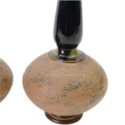 Pair of Royal Doulton vases by Christine Abbot, of squat circular form with elongated neck and flared rim, the body decorated with floral design, H26cm