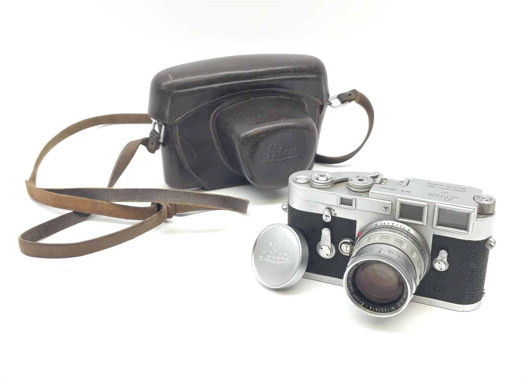 Leica M3 camera body, 1959, chrome finish, serial number '986937', fitted with 'Ernst Leitz GmbH Wetzlar Summicron f=5cm 1:2 Nr.1592614' lens, with Leica M3 instruction booklet