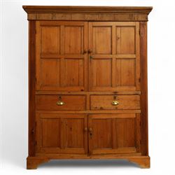 Victorian stripped pine kitchen cupboard, of rectangular form with fluted cornice and top section with two panelled cupboard doors revealing painted shelved interior, middle with two drawers with turned knob handles and brass cup handles, base section with two panelled cupboards, raised on shaped bracket feet 