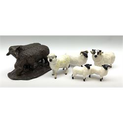 Two Beswick rams, two lambs, and a further sheep, together with a bronzed model of two sheep. 