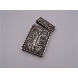 Silver filigree card case, with central vacant cartouche, and worked with scrolls and foliate motifs, unmarked but testing as silver, H9cm, approximate weight 1.30 ozt (40.3 grams)