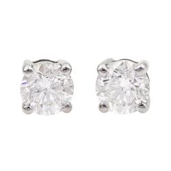 Pair of 18ct white gold round brilliant cut diamond stud earrings, hallmarked, total diamond weight approx 0.70 carat
