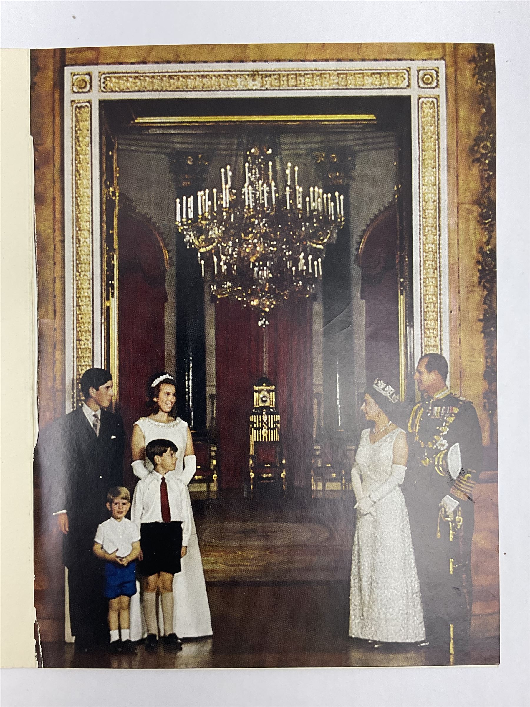 HM Queen Elizabeth II and HRH the Duke of Edinburgh, 1967 Christmas card with two gilt cyphers to front, tipped-in colour print of the Royal Family standing under an archway in Buckingham Palace, signed Elizabeth R and Philip with manuscript date 1967 below