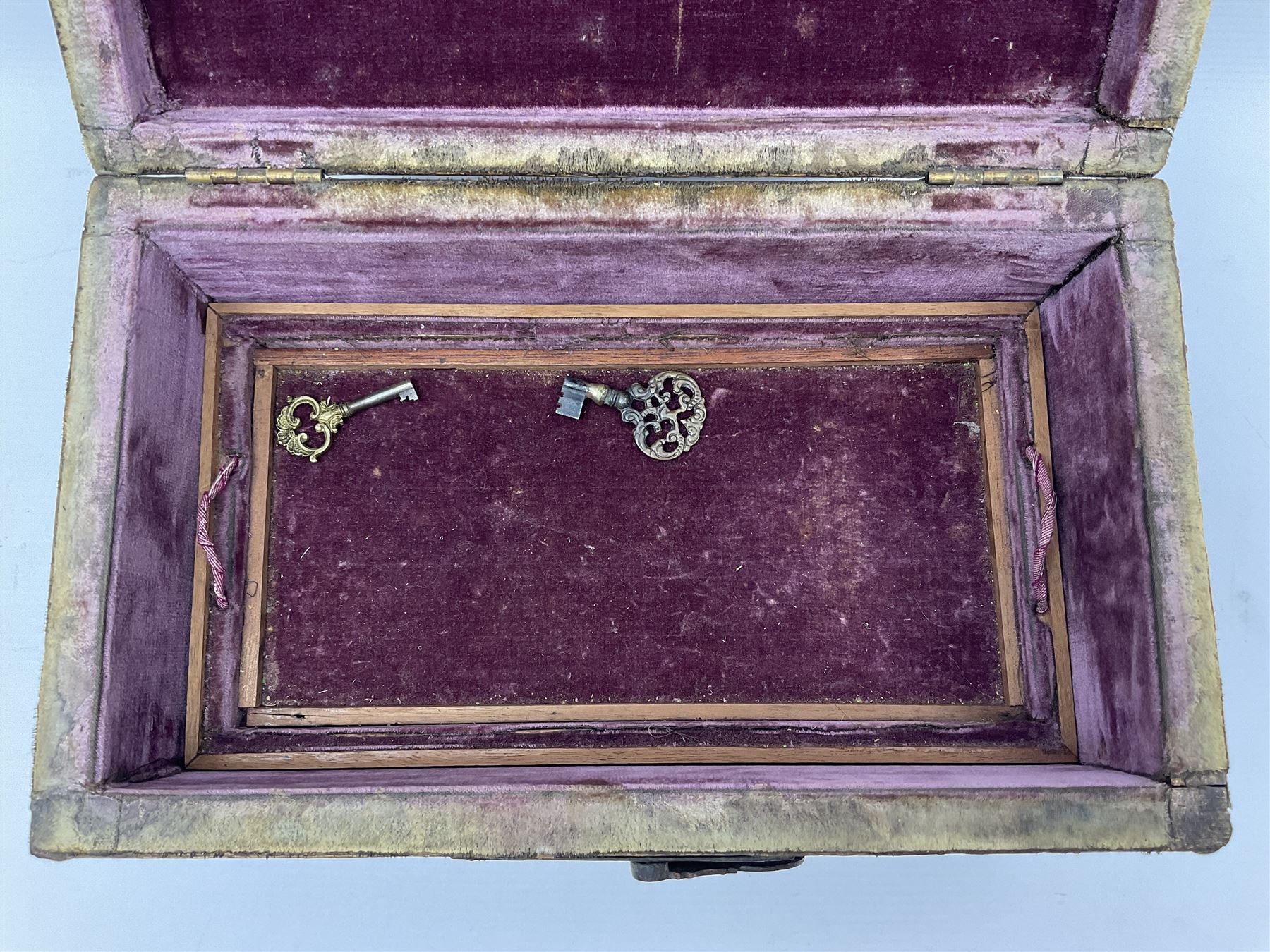20th century box, decorated in faux leather with the royal coat of arms and GR 1719 to hinged cover, with fleur-de-lis, lion, crown and rose motifs throughout and studs to all edges, opening to reveal a purple velvet interior containing three removable wooden trays, H18.5cm
