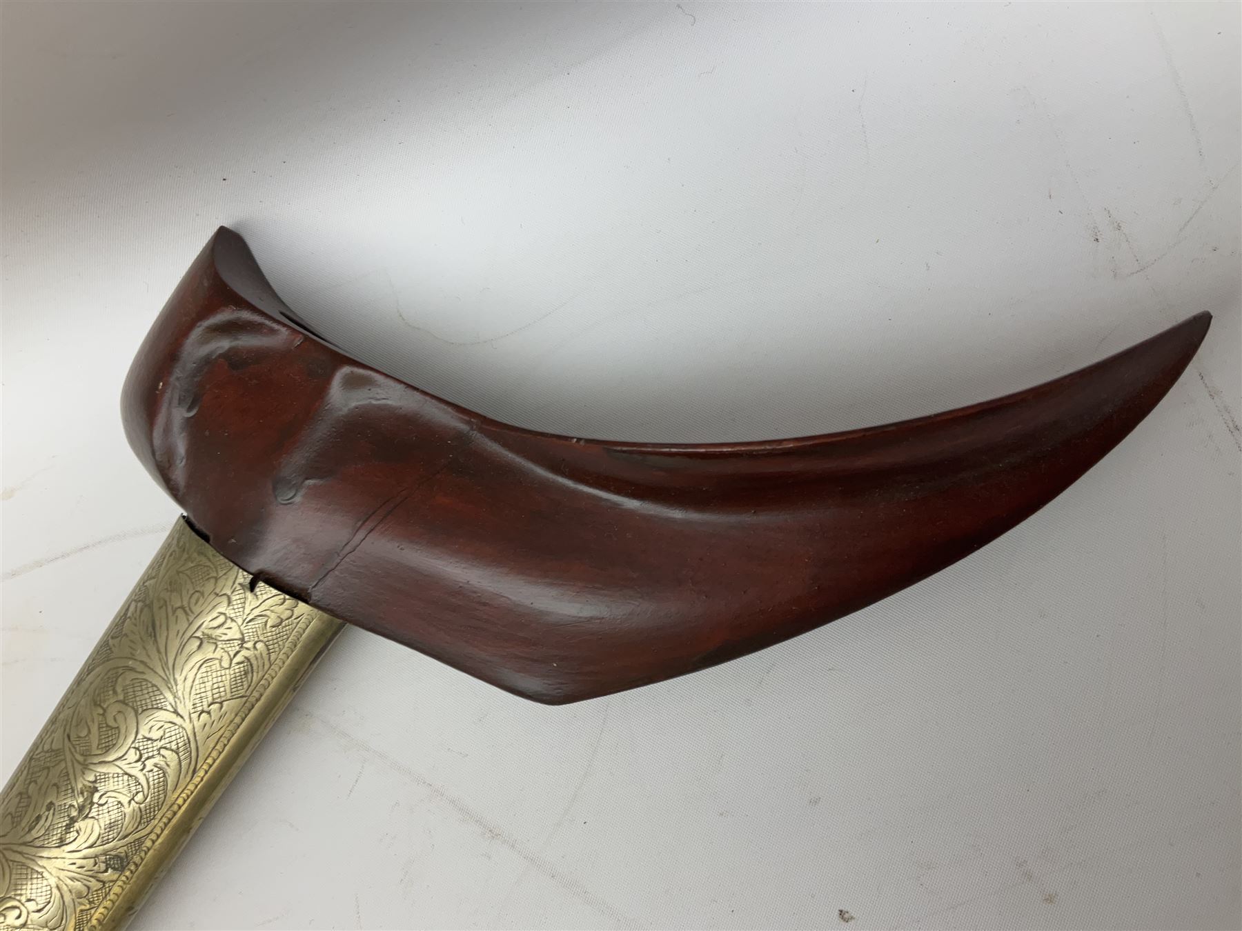 Malayan Kris dagger, the 31.5cm double edged straight heavy damascus blade with copper ferrule; carved hardwood grip; in large wooden throated scabbard with floral decorated white metal covering L47.5cm overall; a kris blade with adapted antler grip; and five various small daggers/letter openers (7)