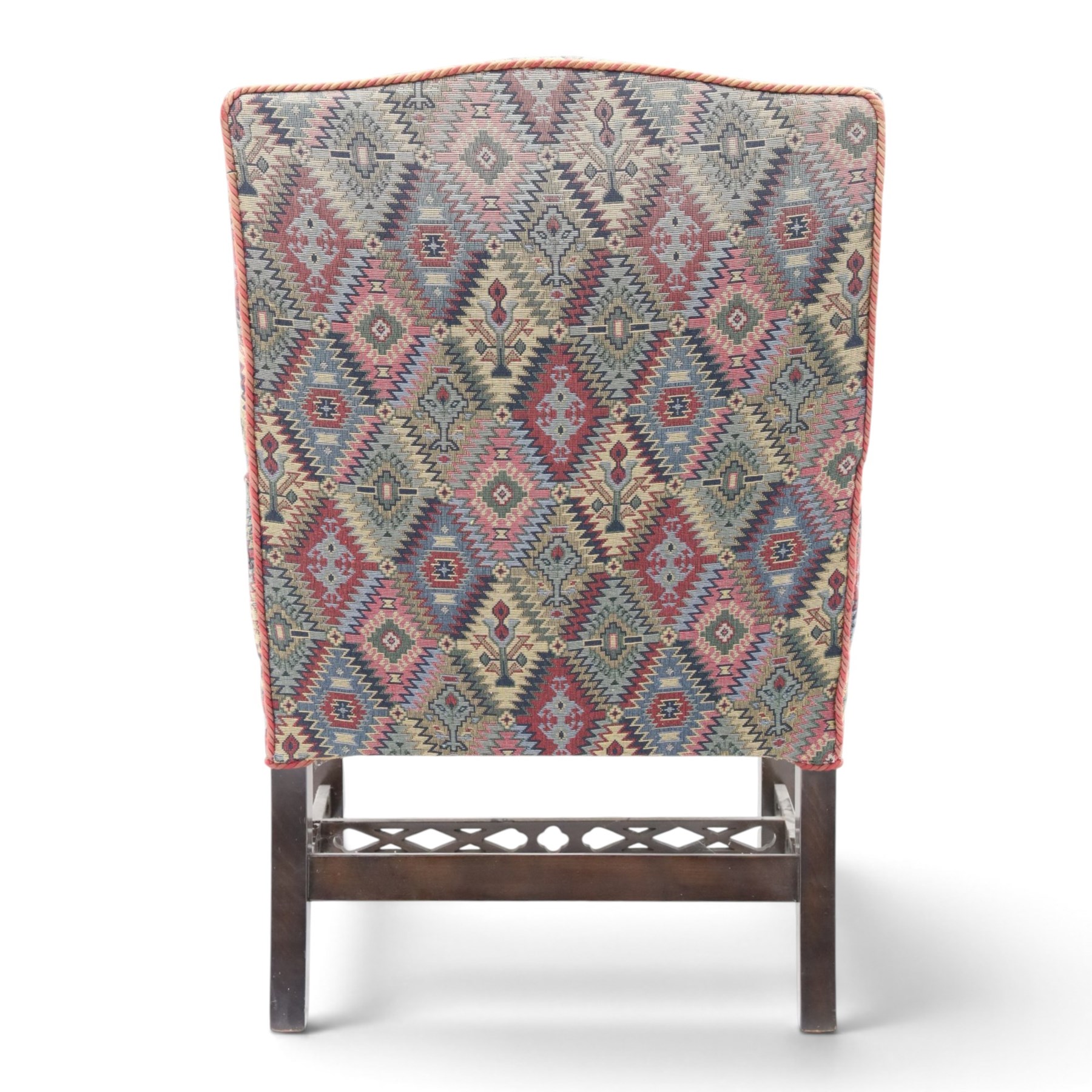 Chippendale design Gainsborough elbow chair, upholstered in kilim fabric, blind fretwork and acanthus carving
