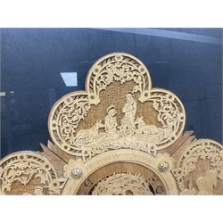 Cork carving of a religious cross depicting intricate scenes of various religious figures and motifs amongst trees and foliage, with central circular panel of Jesus Christ, in glazed frame, H95cm