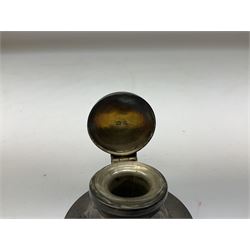 German silver pill box of oval form, the cover decorated with a serpent, stamped with crown and crescent and marked 800, together with a miniature silver capstan inkwell with glass liner, hallmarked Birmingham, a novelty silver teaspoon with golf club terminal, hallmarked Birmingham, and an amber glass scent bottle with silver plated cover, approximate weighable silver (not including inkwell or scent bottle with silver plated cover) 41.9 grams