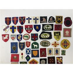 Approximately one-hundred printed and embroidered cloth badges including I, II, VIII, XI, XII and XXX Corps, Eastern Command, various Armoured Divisions, Midland, Wessex, Home Counties and 12th Infantry Brigades, Salisbury Plain, Northumberland, Hampshire, North Midland, West Riding, Essex and Suffolk Districts, Berlin & Rhine Army Troops etc