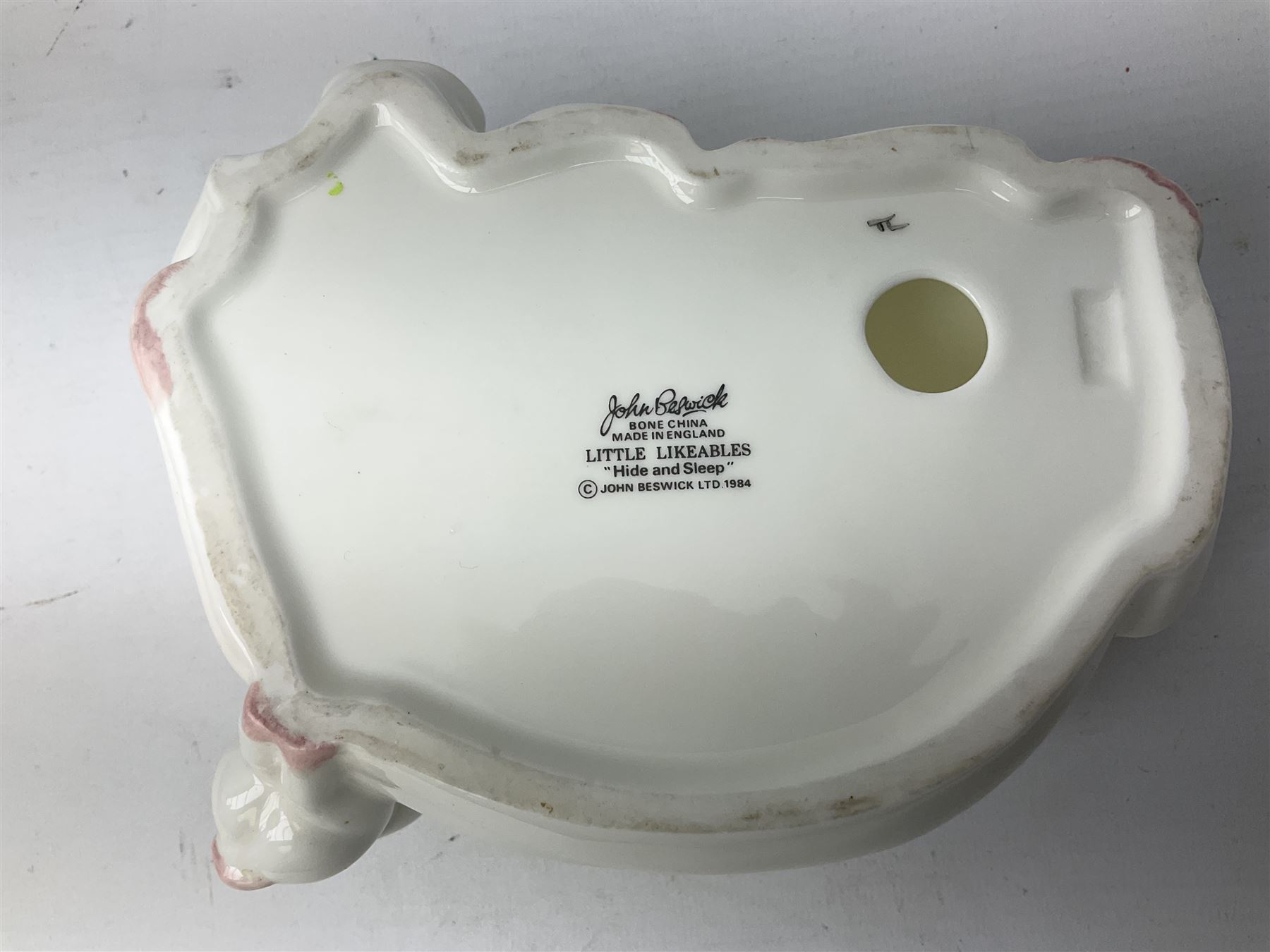 Collection of Beswick pig figures, to include John Beswick Little Likeables ‘Hide and Sleep’, white boar pig and John Beswick trio of pigs, all marked beneath (5)