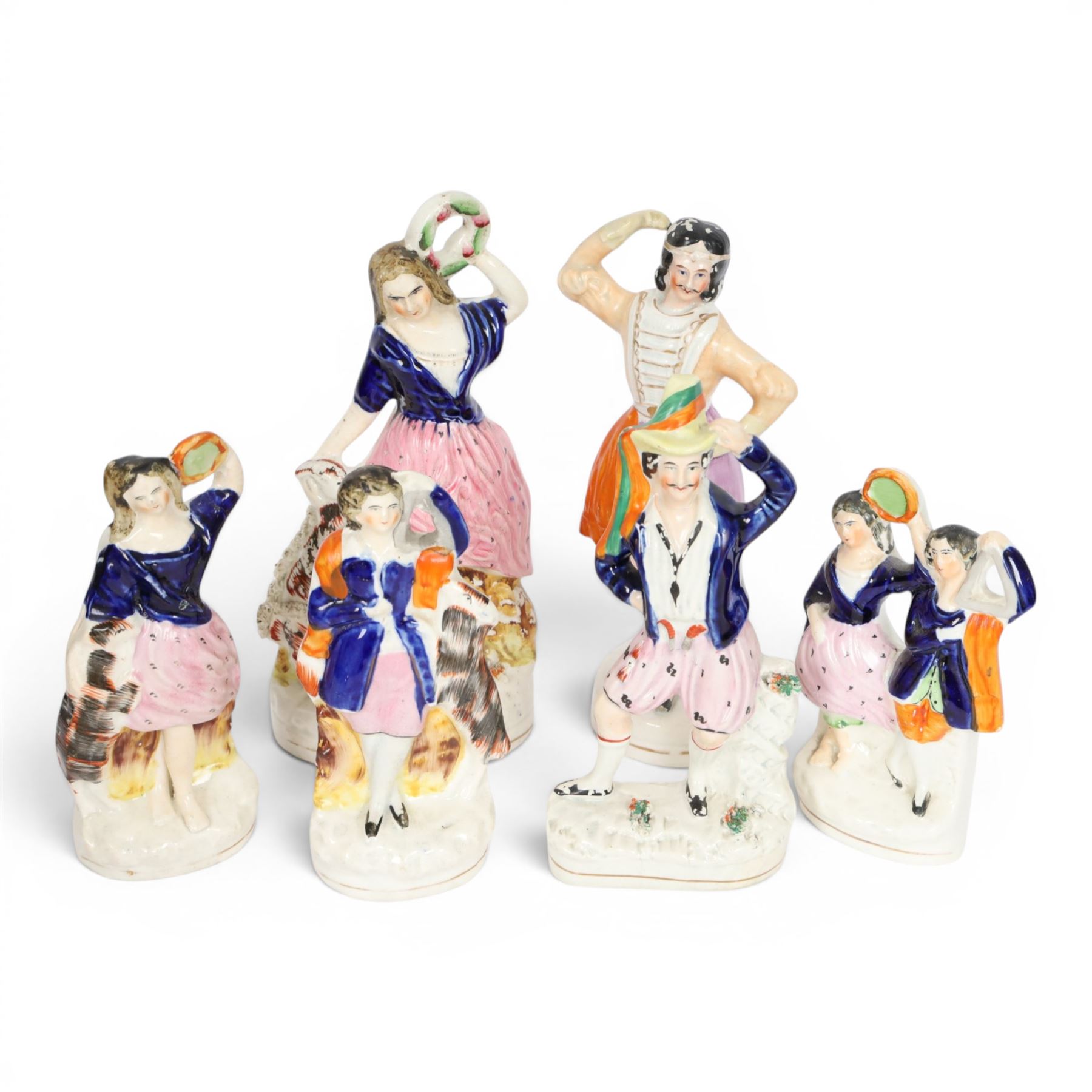 Six 19th century Staffordshire Theatre figures, comprising rare example of Jules Perrot as Diavolino, Jules Perrot as Albrecht, Carlotta Grisi as Esmeralda, Carlotta Grisi as Esmeralda and Jules Perrot as Gringoire, and further pair, tallest example H24.5cm


