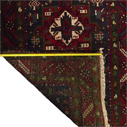 Large Northwestern Persian Hamadan hand-knotted runner, indigo field, with a column of bold geometric medallions and scattered stylized motifs within a madder border of angular rosettes and meandering vines 