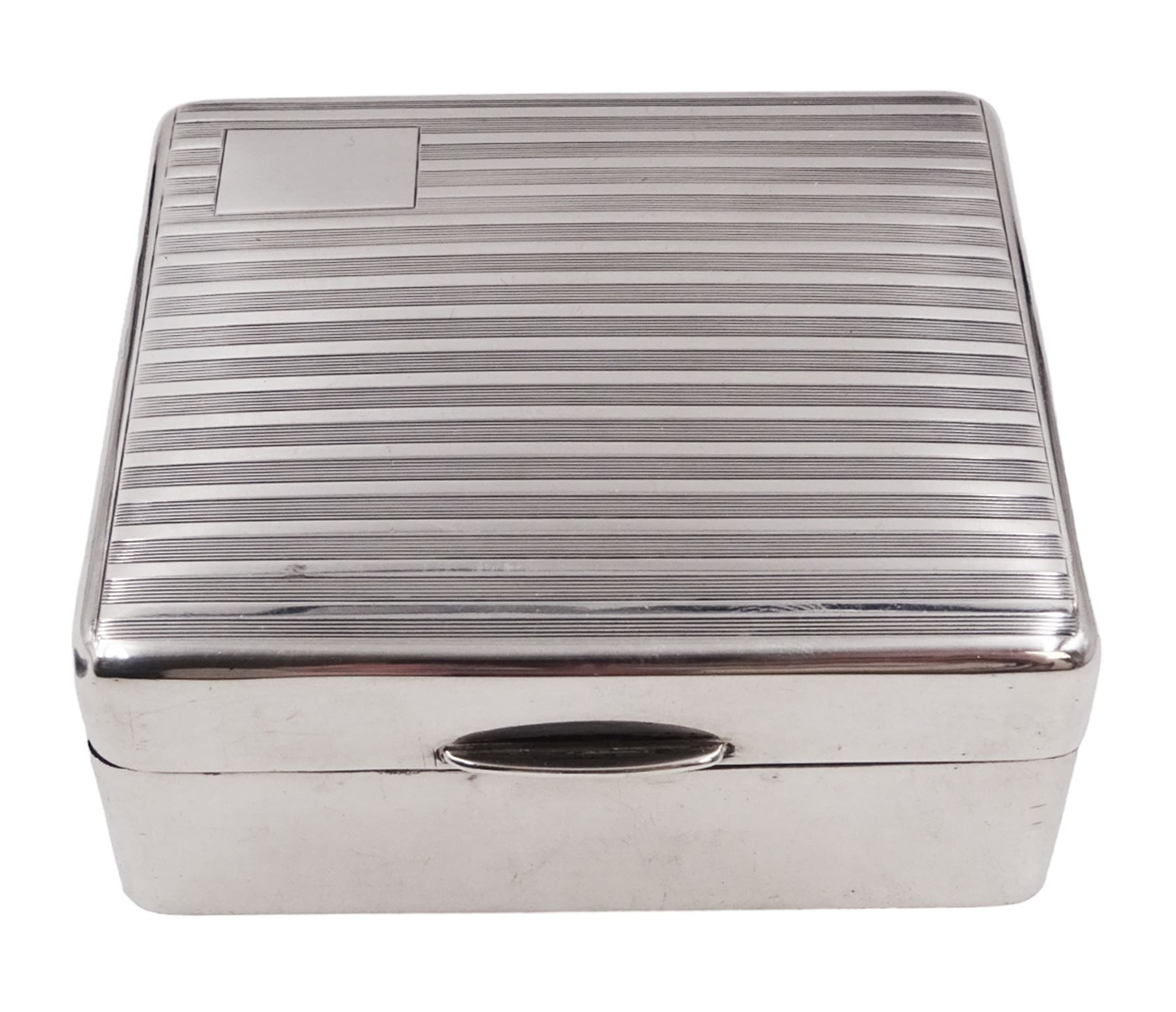 1930s silver mounted cigarette box, of square form, with engine turned decoration and blank rectangular panel to hinged cover, opening to reveal softwood lined interior, hallmarked William Neale & Son Ltd, Birmingham 1934, H3.8cm