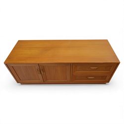 G Plan - 'Fresco' teak side unit, rectangular top above twin cupboard doors and two drawers, drawers fitted with cassette tape storage and a fall front drawer, raised on a plinth base