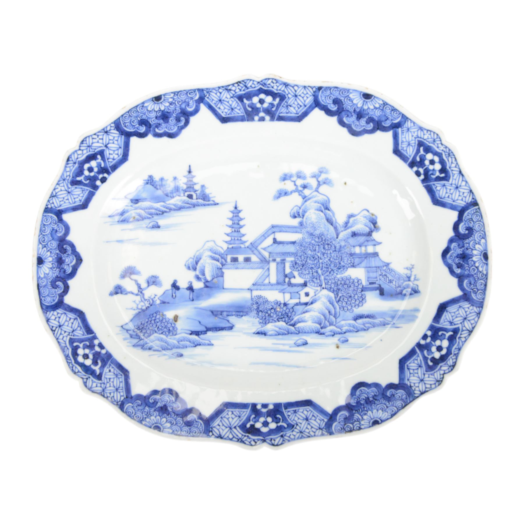 19th century Cantonese plate of octagonal form decorated to the centre with a garden of flowering peonies, together with two other 19th century plates and two serving platters each depicting temples in landscapes, octagonal plate W31cm  