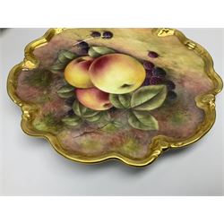 Set of four 20th century Coalport cabinet plates decorated by Richard Budd, each of circular form with shaped rim, hand painted with a still life of fruit upon a mossy ground signed R Budd, with blue printed marks beneath, D23cm