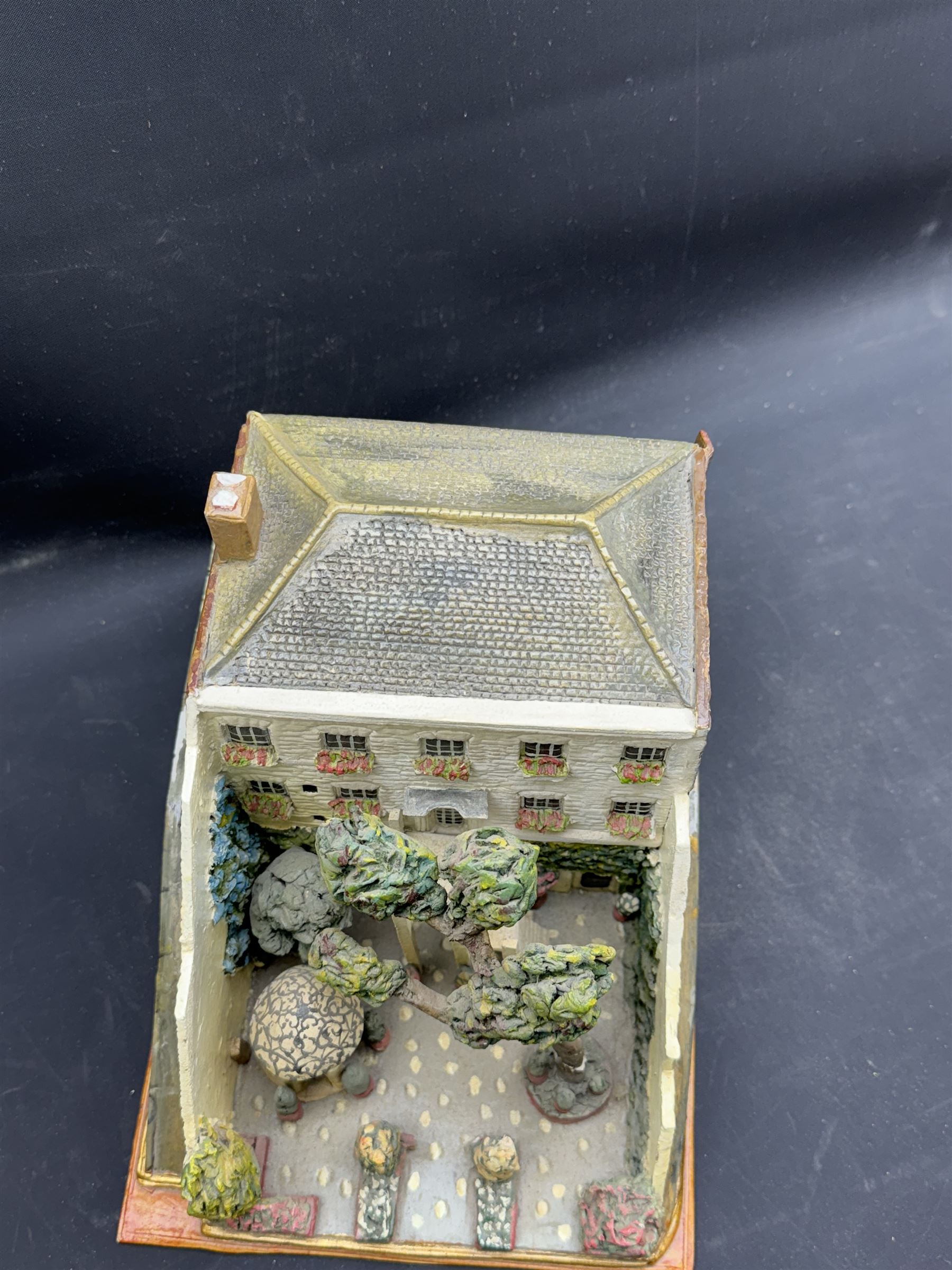 Mixed medium sculpture of house and garden, with makers mark beneath, H15cm